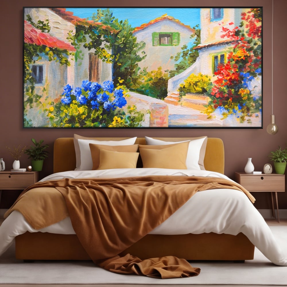 Tablou canvas cu pictura peisaj mediteranean cu case, in rama de aluminiu negru, pe perete intr-un dormitor
